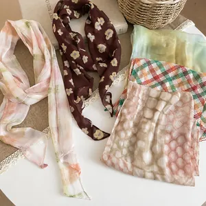 Collection of French retro printed silk scarf necklaces with floral and plaid patterns