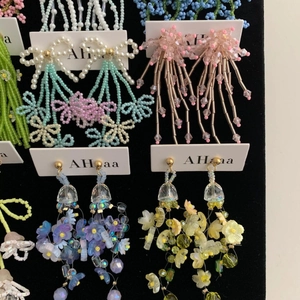 Handmade chiffon flower and rice bead tassel earrings with bow designs and pastel colors