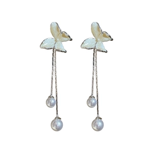 Elegant butterfly stud earrings with long tassel and white pearls on white background