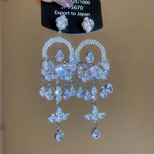 Sparkly silver-tone chandelier tassel earrings with heart and water-drop crystal details