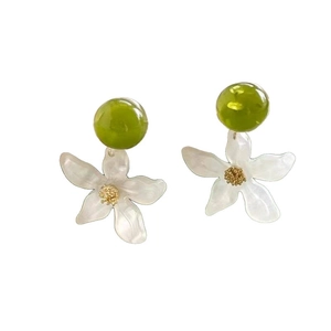 Summer style green resin stud earrings with white flower starfish pendants on white background