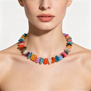 Detail view of a vibrant colorful irregular acrylic candy bead necklace on model