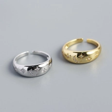 Close-up of S925 sterling silver moon and star rings with zircon inlay and open design