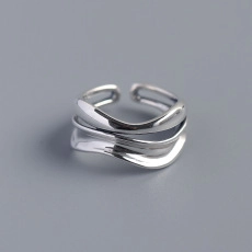 Macro shot of S925 sterling silver crying face ring with multi-layer wave design