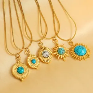 Detailed macro view of five bohemian gold-plated necklaces with turquoise on golden silk