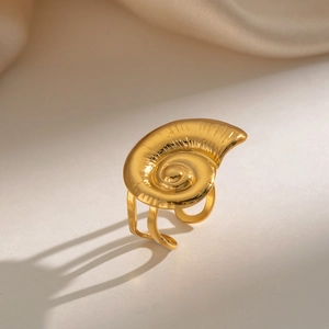Detailed view of the golden nautilus shell ring with a unique spiral relief design