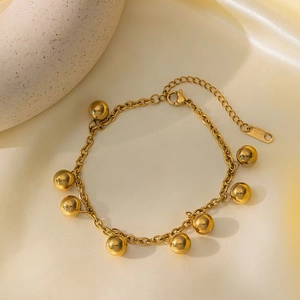 Elegant gold titanium steel necklace with spherical pendants on a minimalist O-chain
