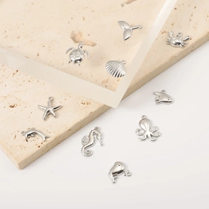 Detailed set of silver marine life charms including seahorse, turtle, and starfish shapes