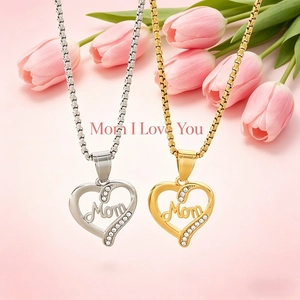 Detail of silver and gold heart pendants with Mom lettering and sparkling rhinestones