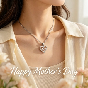Close-up of sparkling heart necklace with Mom lettering worn for Mother's Day gift idea