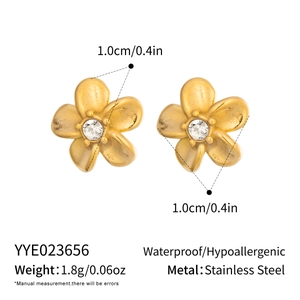 Detail showing 1.0cm gold stainless steel flower stud earrings with CZ stone and specs