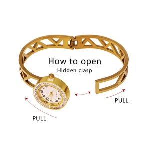 Elegant gold hollow stainless steel bangle watch with sparkling crystals and hidden clasp
