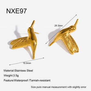 Macro view of 18K gold-plated stainless steel hummingbird earrings with size details