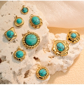 Detailed view of vintage gold-plated pendants with turquoise stones in various geometric shapes