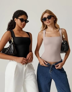 Detail of square neck slim fit tank tops in black and lavender with wide straps