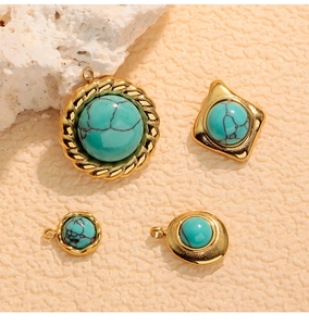 Detail of turquoise pendants set in gold-plated stainless steel with geometric shapes