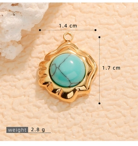 Detail of turquoise pendant with gold wavy frame showing 1.7cm size and 2.8g weight