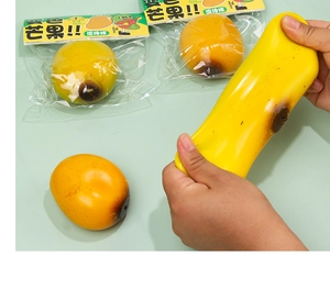 Detailed close-up of stretching the mango squishy stress toy showing flexible texture