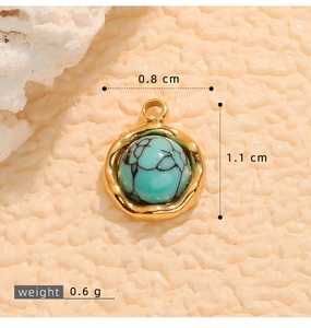 Detailed view of turquoise stone pendant with gold wavy frame, 0.8 cm width and 0.6 g weight