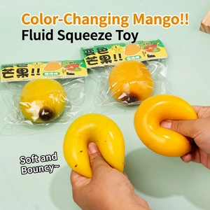Color-changing mango squishy stress relief toy with fluid filling on mint green background