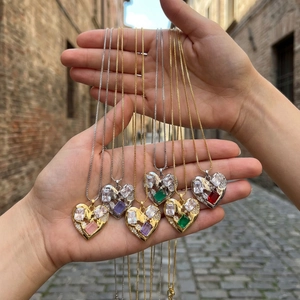 Macro shot of luxury heart-shaped zircon pendants on copper chains in multiple colors