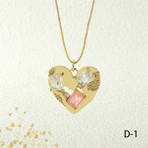 Detail of 18K gold plated heart pendant necklace with zircon stones and fine gold chain