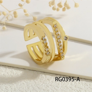 Macro shot of gold plated multi-layer geometric ring with clear cubic zirconia stones