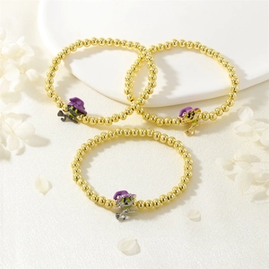 Three-piece Halloween witch cat charm bracelets with golden beads and colorful accents