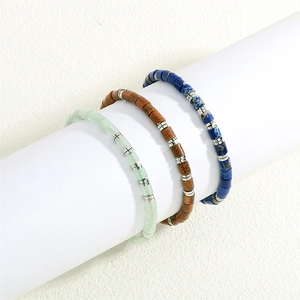 Detailed view of handmade woven bracelets with semi-precious stone barrel beads and silver spacers
