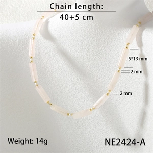Detail view of handmade beaded necklace with pink semiprecious stones and freshwater pearls