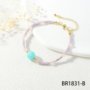 Detail view of macaron beaded bracelet with pastel semi-precious stones and gold clasp