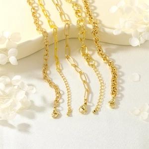 Detailed set of gold metal layered chains including paperclip and rope styles with clasps