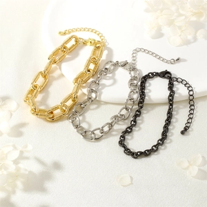 Detailed view of heavy metal chains in gold, silver and black with lobster clasps