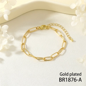 Detail view of gold-plated paperclip chain bracelet with lobster clasp and extender