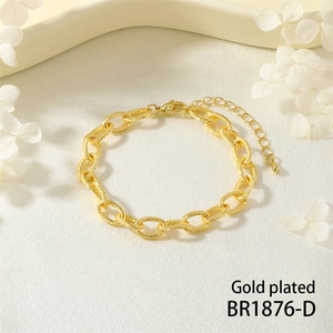 Macro shot of gold plated twist texture links with lobster clasp and extension chain