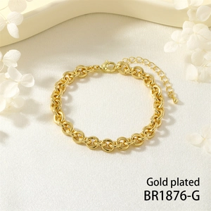 Detailed macro view of a gold plated rollo chain bracelet with lobster clasp and extender