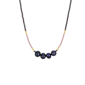 Elegant beaded clavicle chain featuring dark pearls and pink seed beads for daily wear.