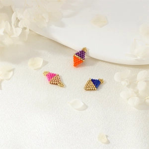 Handmade ice cream cone shaped seed bead charms in pastel colors on white silk