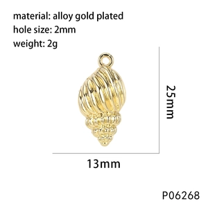 Détail du pendentif coquillage en alliage doré avec trou de 2mm pour création bijoux