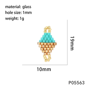 Detail of handmade dual-tone green and gold seed bead charm showing 19mm x 10mm dimensions