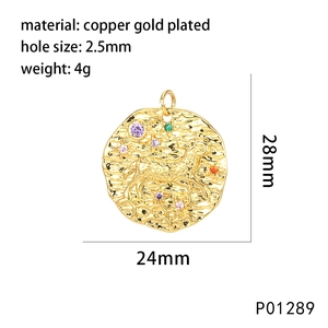 Macro detail of Aries zodiac gold plated copper pendant with colorful zircon stones