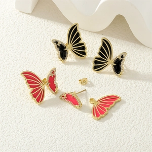 Macro shot of 18k gold plated butterfly earrings with micro-inlaid zircon and enamel