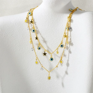 Collana a strati dorata boho con occhio di Allah, margherita e ciondoli a stella