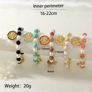 Detail of beaded snake charm bracelets showing dimensions, stone beads and gold pendants