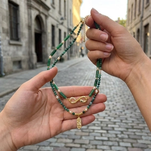 Emerald gemstone and pearl necklace with golden infinity snake pendant and rectangle charm