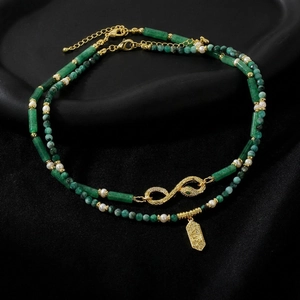 Emerald gemstone and pearl beaded necklace with gold infinity charm and snake motifs