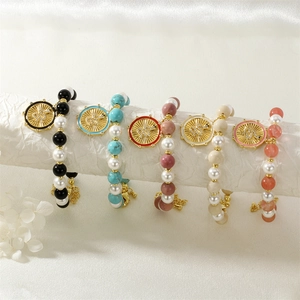 Five-piece boho stretch bracelet set with faux pearls and gold snake charm pendants