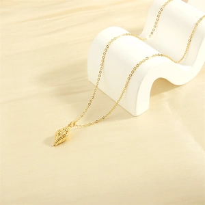 Elegant 18K gold-plated necklace with a detailed conch shell pendant on a wave-shaped stand
