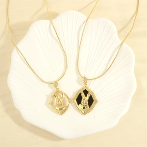 Close-up of hip hop rabbit pendants with cubic zirconia on gold plated snake chains