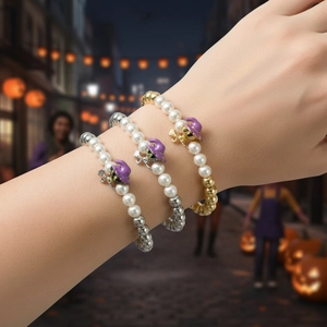 Three-piece Halloween beaded bracelet set featuring purple witch hat enamel charms
